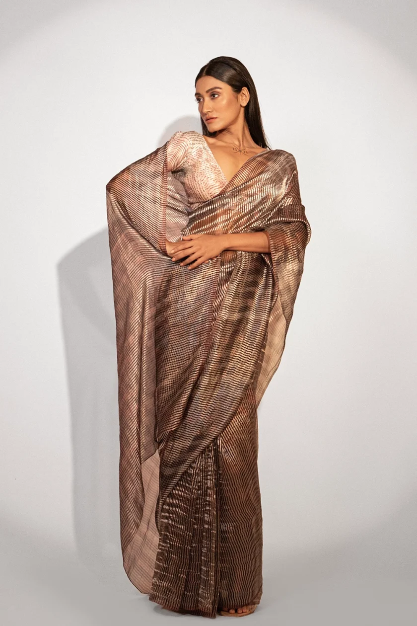 Unallume Print saree designs Unique saree designs Artisan saree designs Indian print sarees Printed saree party wear Printed saree silk Cocktail Saree, Party wear saree, Unallume, Metallic Golden Red Gray designer saree bollywood saree indian saree silk saree fashion art inspired fashion handloom trendy cocktail saree party wear artistic fashion fashion trends indian saree tissue organza pure silk ready to wear saree cotton saree printed saree handloom saree